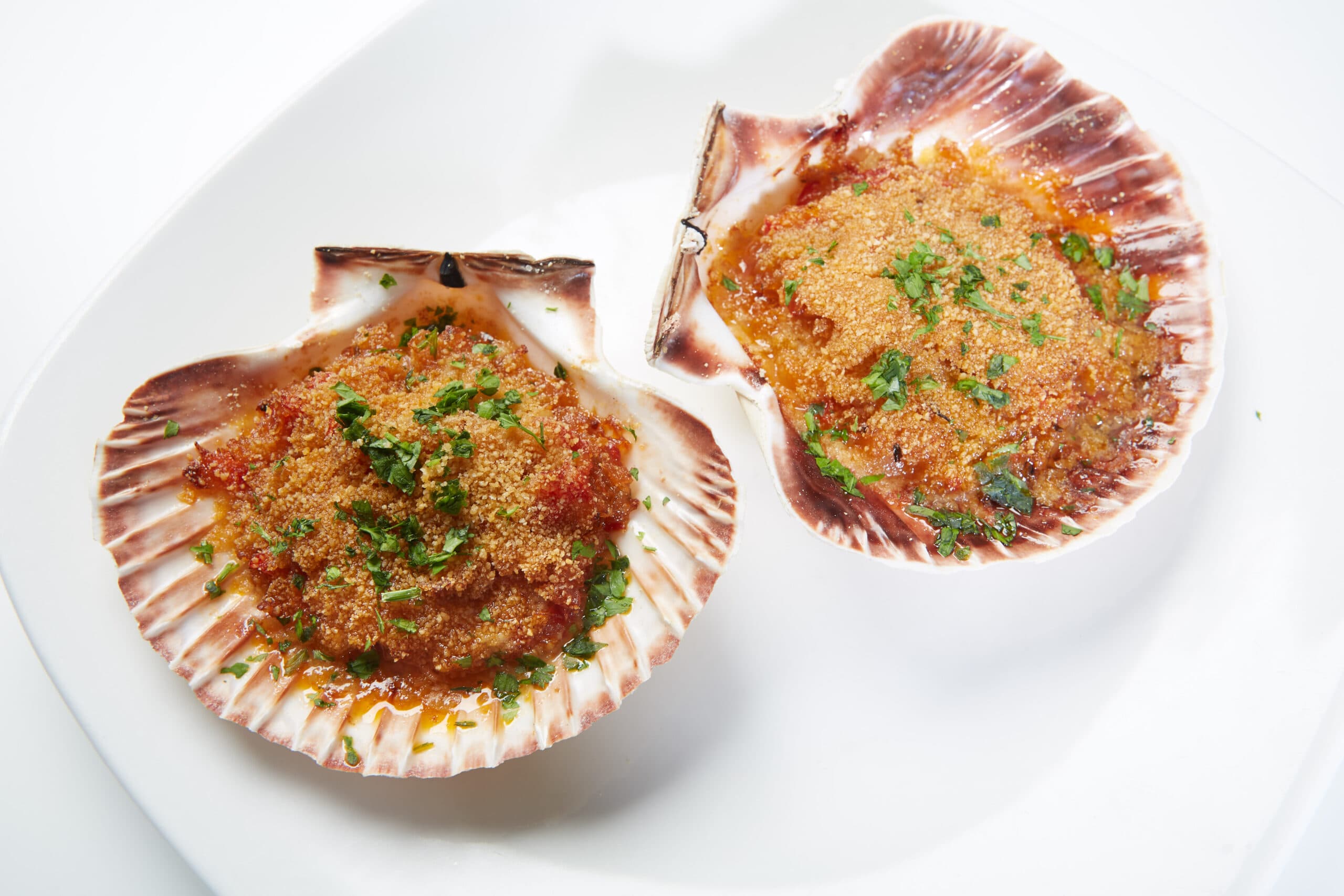 Vieira con salsa marinera al horno
